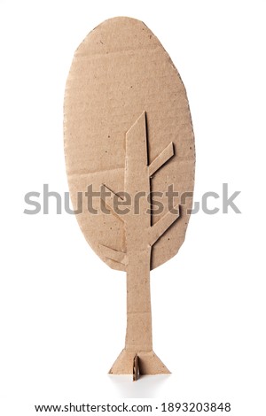 Amazing tree made of cardboard on a white background. Children art project. DIY concept. Cardboard craft.