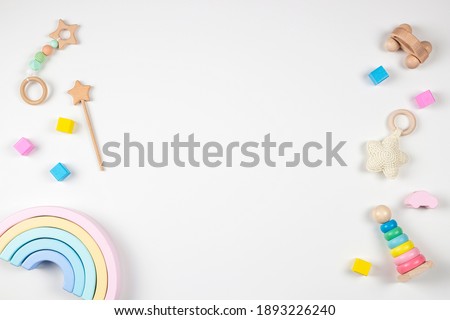 Baby kids toys frame on white background. Top view. Flat lay. Copy space for text Royalty-Free Stock Photo #1893226240