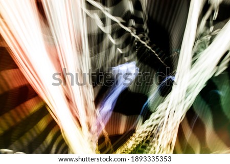 Abstract background with created in camera with diagonal wavy lines of red, blue and white spectrums of light. Stock Photo.