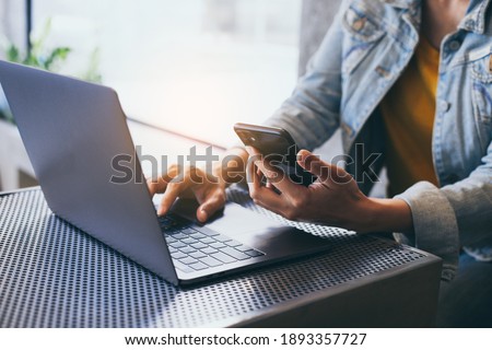 man work using typing computer texting cell phone.student study education online learning.adult professional chatting on laptop,mobile contact us at Thinking business plan.connecting people concept Royalty-Free Stock Photo #1893357727