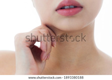 A woman who pinches the fat on her jaw. Royalty-Free Stock Photo #1893380188
