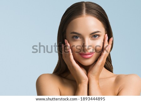 Beauty woman skin care beautiful female hand touching face cosmetic girl model over blue background