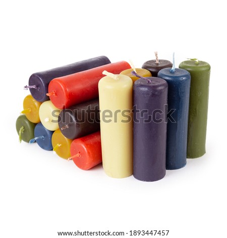 Multicolored candles on white background.
