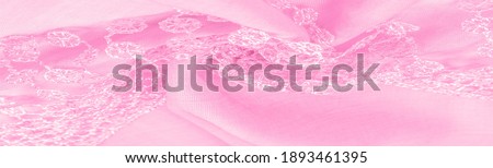 Spring pink silk with lace capes. Smooth elegant pink silk or luxe satin can be used as an abstract background. Background texture, postcard template