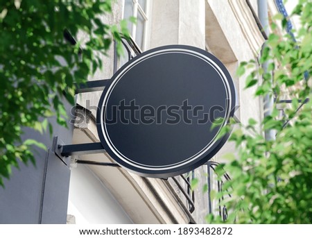 Circular store brand sign board mockup. Empty rounded shop frontage in street Royalty-Free Stock Photo #1893482872