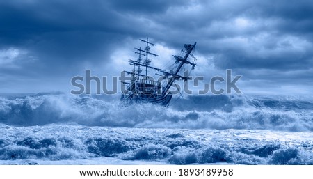 Sailing old ship in a storm sea in the background stormy clouds Royalty-Free Stock Photo #1893489958