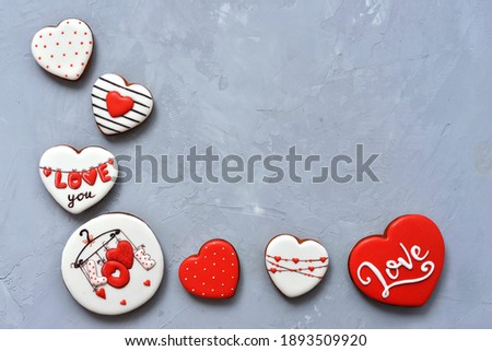 Valentine's day Homemade cookies on Ultimate Gray background, top view. Space for text. Delicious and sweet, covered with icing with a beautiful pattern gingerbread