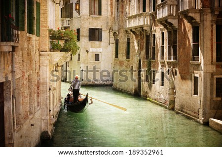 Gondola travels down the canals of Venice in Italy