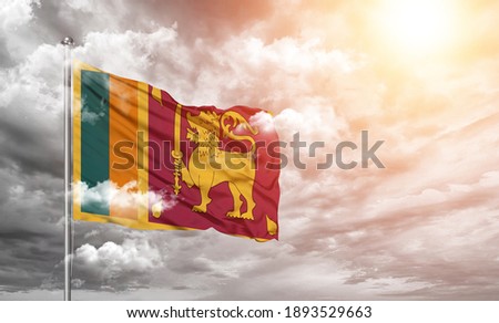 Sri Lanka national flag cloth fabric on cloud background.