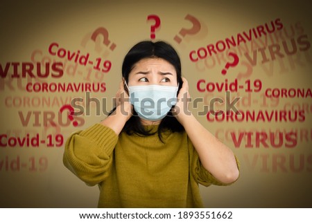 depressed Asian woman with protective mask scared of covid-19 virus having panic and worry to get sick  Royalty-Free Stock Photo #1893551662