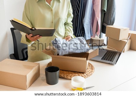 Online small business entrepreneur merchants working at store preparing products to deliver to customers, startup and online business concept Royalty-Free Stock Photo #1893603814