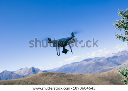 Flying drone taking photo of  landscape in China