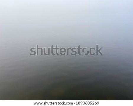 Foggy lake view in winter