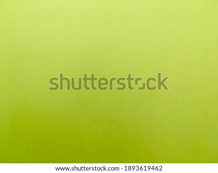 Bright green concrete wall texture and background 