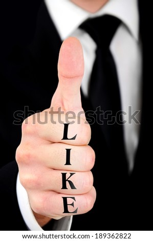 Businessman showing ok sign with like word