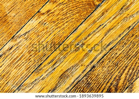 Antique parquet floor. Natural oak tree texture. Wooden background with organic pattern vintage planks. Macro photography, up view