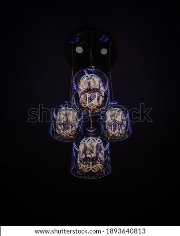 Hanging lamp lights with black background, chandeliers or bulbs glowing and shining lights.
