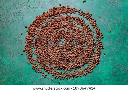 Beautiful composition with coffee beans on color background. Zen concept