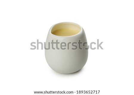 Gravy boat with condensed milk isolated on white background Royalty-Free Stock Photo #1893652717