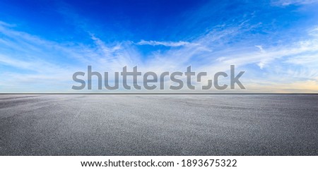Empty asphalt road and blue sky with white clouds.Road background. Royalty-Free Stock Photo #1893675322