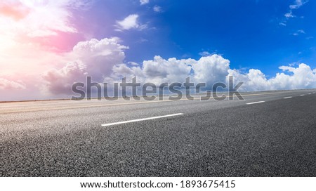 Empty asphalt road and blue sky with white clouds.Road background.