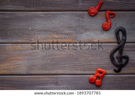 Abstract music notes made of rubber, top view. Music background