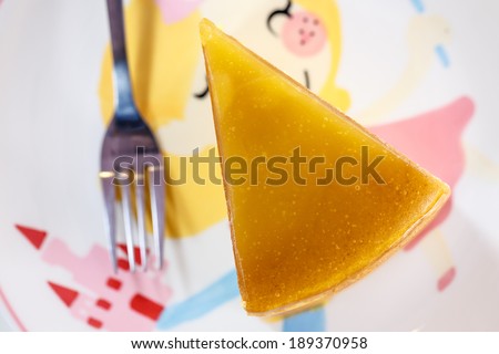 Orange cheese cake on sweet pattern dish