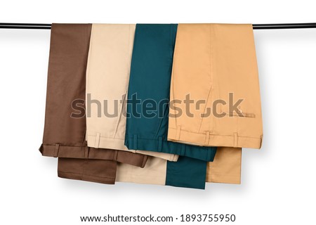 Chino Pants Isolated On White background. Hanged Cotton Pants. Trouser. Royalty-Free Stock Photo #1893755950