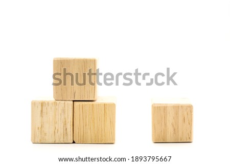 Photos of four brown wood blocks. On a white background on the left of the picture are three wooden blocks. On the right side of the picture there is one block.