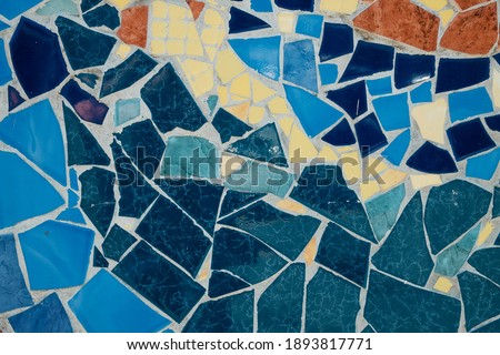 Colorful ceramic mosaic floor or wall. mosaic top view. Bathroom or kitchen floor wall design idea. Reused broken tile. Interior design. Colored eastern pottery.