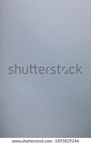 Gray background with texture, vertical, place for text. Empty place.