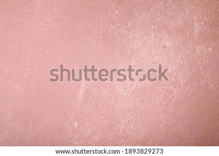 Pink background with paper texture, horizontal, blank space.