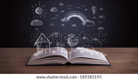 Open book with hand drawn landscape on wooden deck