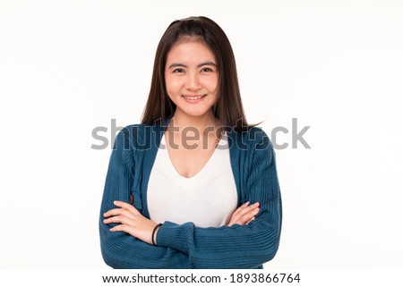 Beautiful young woman portrait. Studio shot, isolated on white background. Beautiful woman with black hair and brown eyes wearing casual t-shirt standing over white background. 