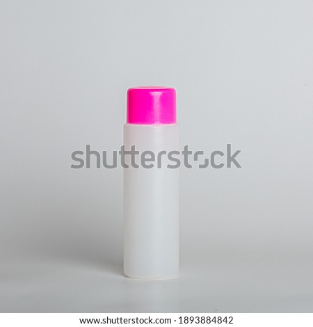 white transparent plastic container, for antiseptic, cleaning products. bottle on a white background, close-up