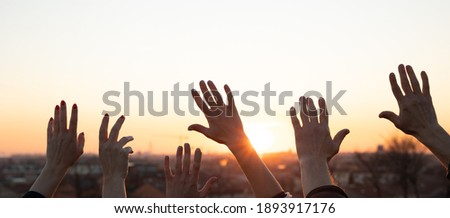 Hands up at the sunset