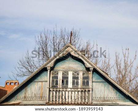 Beautiful carved traditional wooden pediment of an old Russian house close up