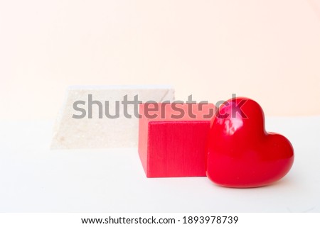 Minimal modern product display on neutral beige background with hearts and shadow overlay, valentines day concept