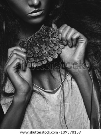 monochrome photo of accessory in woman hands