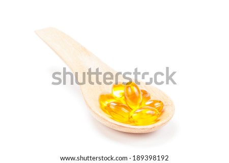 cod liver oil on wooden spoon