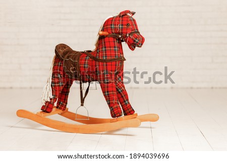 Children's swing in the form of a horse