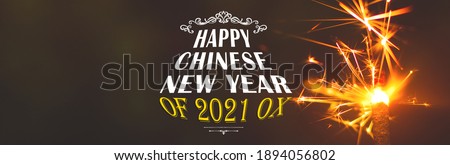 Festive celebrate banner of Happy Chinese New Year 2021 of ox with sparks, fireworks and bengals, copy space photo