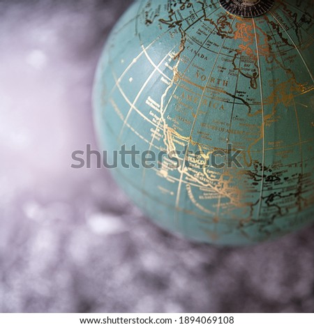 A high angle shot of a beautiful decorative globe on the soft blurred background