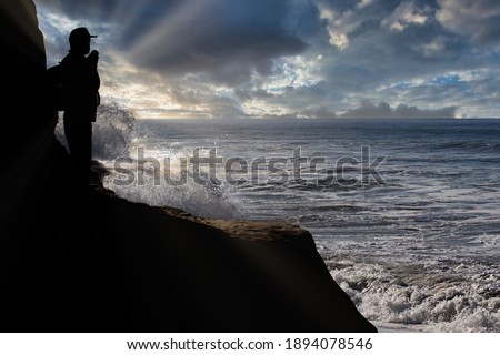 Photographer overlooking the big surf
