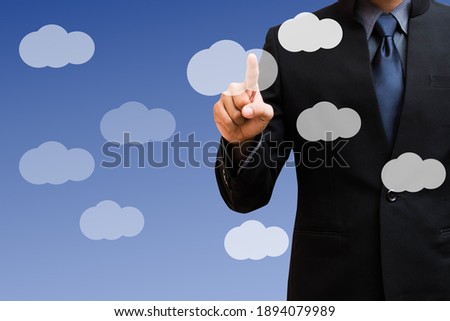 Businessman pressing clouds button on touch screen interface and select 