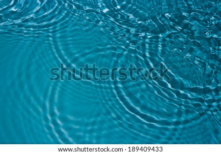 circles on the water surface and glare light