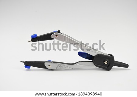 pair of compasses on white background