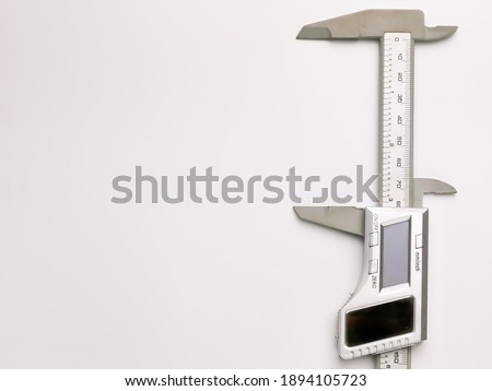Top view of digital calipers isolated on white background.
