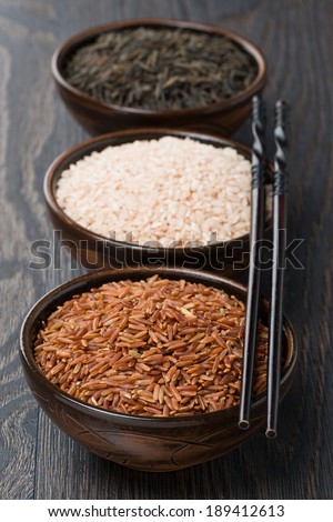 Assorted rice in bowl and chopsticks, vertical