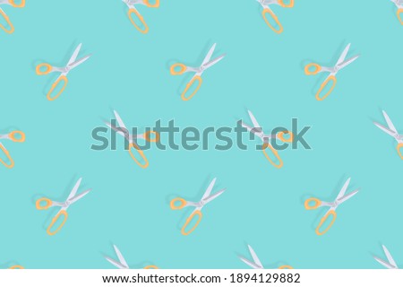 Scissors seamless pattern. Hairdressing scissors against aquamarine background backdrop.